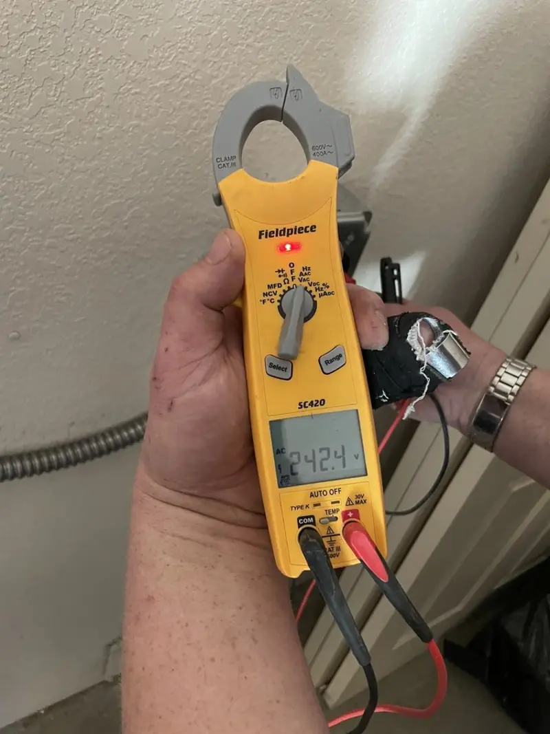 Voltage testing with clamp meter during Circuit Breaker Repair in Elkin